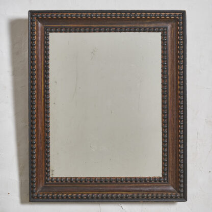 Miroir Napoleon III décor à frise de perles en bois