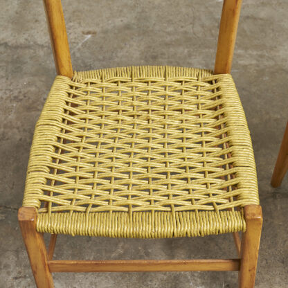 Dans le goût d'Otto Gerdau, paire de chaises aux assises tressées. Italie, vers 1970